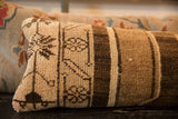 Textured hand-knotted pile of a vintage Oushak rug fragment lumbar pillow.