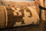 Textured brown and beige geometric pattern of a vintage Turkish lumbar pillow.