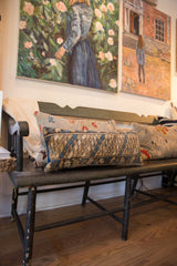 Vintage Caucasian rug lumbar pillow featuring geometric diamonds in blue, brown, and beige.