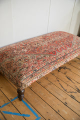 Vintage Persian rug ottoman side, rusty red, denim blue, ivory pattern, curved leg.