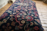 Hand-knotted Yezd rug fragment, late 19th century navy field, faded magenta and ivory floral designs.