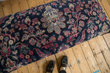 Finely hand-knotted vintage Yezd rug fragment with navy field, faded magenta, ivory florals.