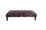 Vintage Persian Yezd rug ottoman, navy and multi-color floral pattern, curved wooden legs.