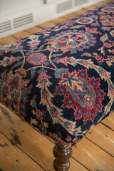 Hand-knotted Yezd rug fragment texture with faded magenta, navy, and ivory floral motifs.