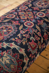 Hand-knotted early 20th century Yezd rug pattern: navy, faded magenta, ivory floral motifs.