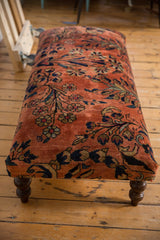 Finely hand-knotted Lilihan rug fragment detail: dusty rose field, navy and gold floral patterns.