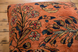 Hand-knotted vintage Lilihan rug detail in dusty rose with floral motifs and visible wear.