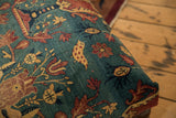 Detail of the antique Persian rug ottoman's pictorial chicken motif.
