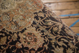 Textured, hand-knotted pile of the vintage Mahal rug showing charcoal and terracotta motifs.