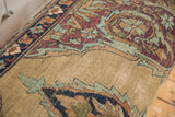 Detail of antique Kerman rug fragment, sand ground with aubergine, dusty blue motifs, foundation showing.