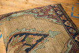 Worn sand and beige field of antique Kerman rug fragment, with blue, aubergine motifs.