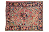 Vintage Heriz rug with a bold quatrefoil medallion in ruby red and navy, and a wide Samovar border.