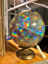 Vintage Replogle holographic globe with vibrant rainbow prism effects.