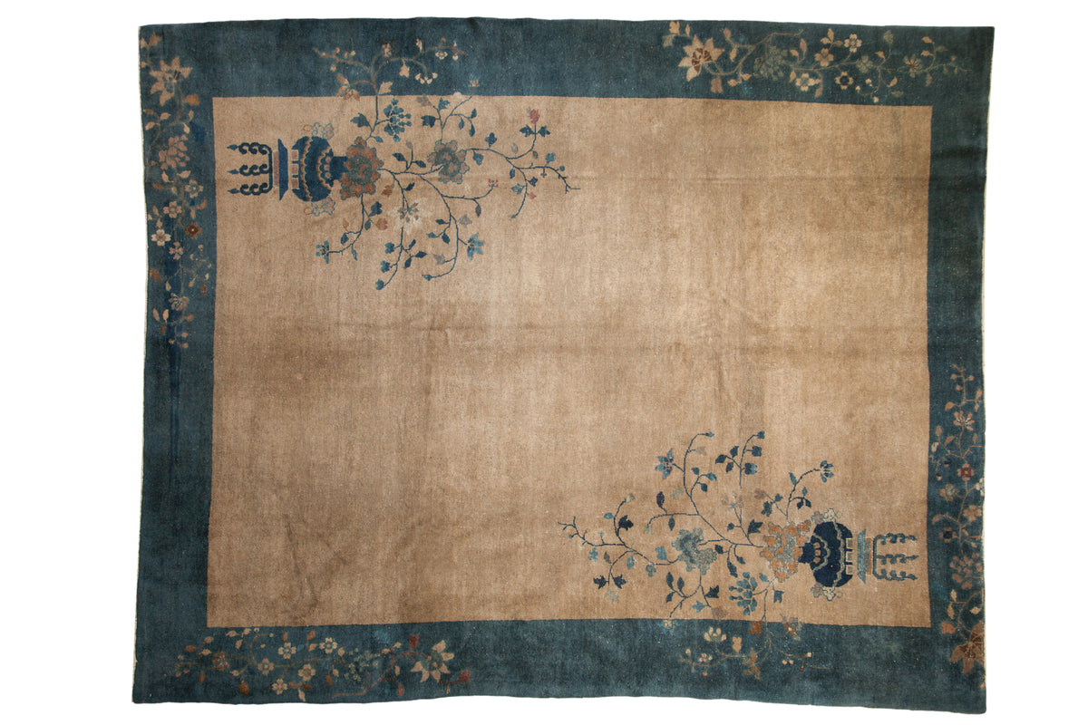 Vintage Peking carpet, minimalist antique ivory field, deep sapphire blue border, potted plant designs.