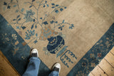 Deep sapphire blue border with arts and crafts potted plant on vintage Peking carpet.