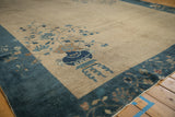 Vintage Peking carpet corner detail: deep sapphire blue border, copper brown floral motifs.