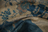 Sheen and speckled texture of the Peking carpet's sapphire blue and ivory pile.