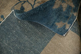 Hand-knotted Peking carpet foundation, revealing warp, weft speckling, and deep sapphire pile.