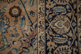 Traditional Persian Meshed carpet detail: Shah Abas design with bronze, navy, and copper palmettes.