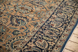 Navy border with sand and copper palmettes, complementing the low pile field of the vintage Meshed carpet.