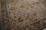 Vintage Persian Meshed carpet with intricate Shah Abas floral design and navy border.