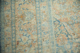 Even wear across the knot heads of a vintage Khoy carpet, revealing pale blue and apricot floral motifs.