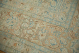 The even, low-pile wear on a vintage Persian Khoy with apricot and powder blue designs.