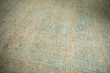 Surface view of the distressed Khoy carpet's even wear and time-softened color palette.