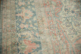 Worn low-pile texture showing the hand-knotted foundation of a vintage Persian Mahal rug.
