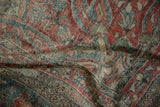 Pliable, distressed weave of a vintage Mahal carpet in dusty red, blue, and jade green.