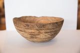 Lower view of the vintage wooden bowl, highlighting hand-carved lines and rustic texture.