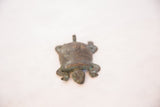 Textured head and front legs of the vintage African copper turtle, verdigris patina.