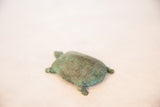 Textured vintage copper turtle shell, rich with green patina.