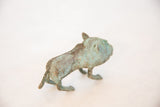 Rough, oxidized copper texture on the back of the vintage African animal sculpture.