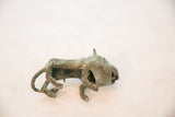 Profile view of a vintage copper wild thing, showing its textured head and open mouth.