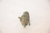 Overhead view of the vintage copper wild animal, detailing the carved face and oxidized patina.
