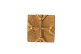 Handmade vintage square bronze coin with a raised cross motif and aged patina.