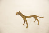Collectible vintage African bronze cheetah displaying its textured, spotted patina.