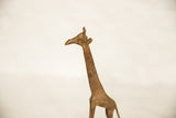Vintage African bronze giraffe's head and neck, highlighting its handmade texture and aged patina.