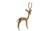 Vintage African bronze gazelle sculpture facing right in an alert pose with a rustic patina.