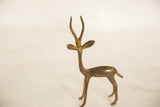 Vintage African bronze gazelle showing its alert posture and handmade, patinated finish.