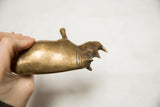 Golden patina and aged, textured surface of a vintage African bronze rhino.