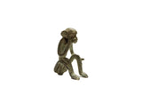 Collectible vintage handmade African bronze sitting monkey sculpture with patina.