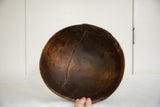 Interior of the vintage African wooden bowl, highlighting its distinctive crack.