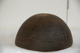 Subtle geometric carvings and rich dark brown patina on the vintage wooden bowl.