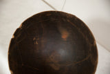 Close-up of the vintage African wooden bowl's interior with deep brown patina.