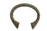 Vintage African bronze C-shaped bracelet with a distinctive aged greenish-brown patina.