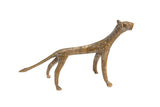 Vintage African bronze cheetah figurine with textured dotted surface and aged patina.