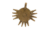 Vintage African handmade bronze crocodile head medallion with coiled texture and radiating forms.
