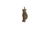 Vintage African bronze pendant with a textured, abstract form and dark patina.